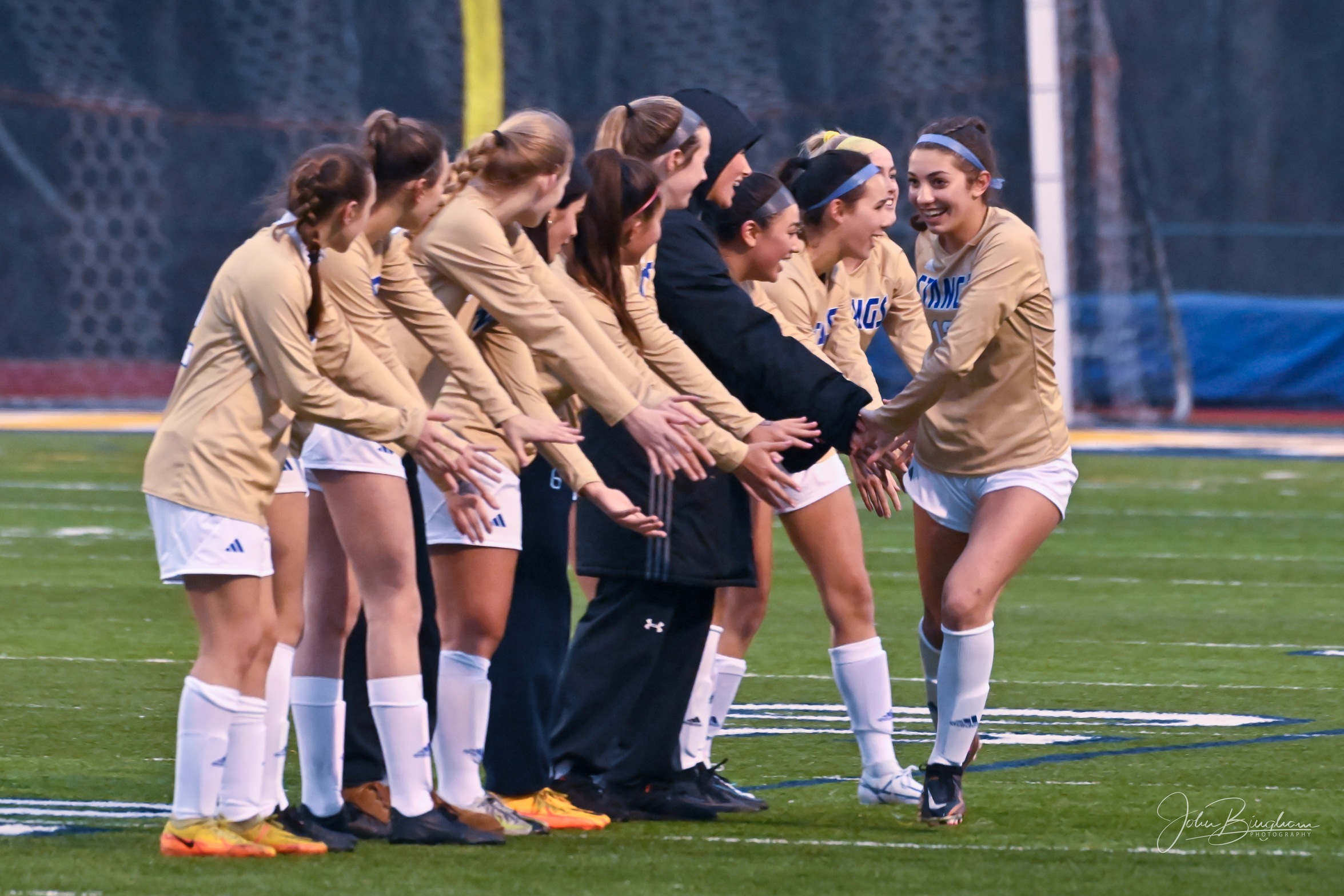 Marian players get ready for the season opener at Walled Lake Central on March 22.